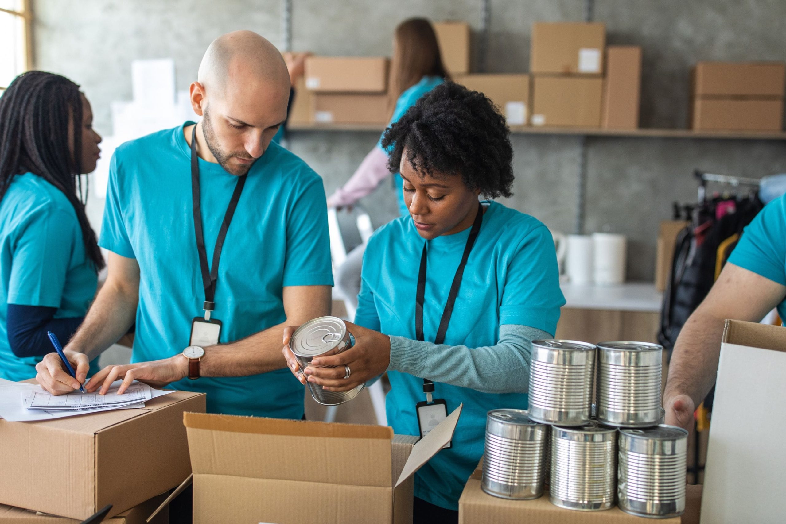 Group of friends doing charity work in charitable foundation