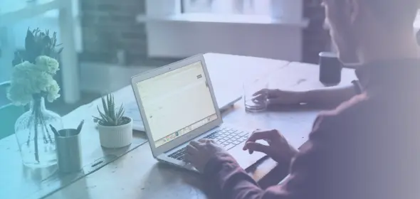Man at a laptop in an office